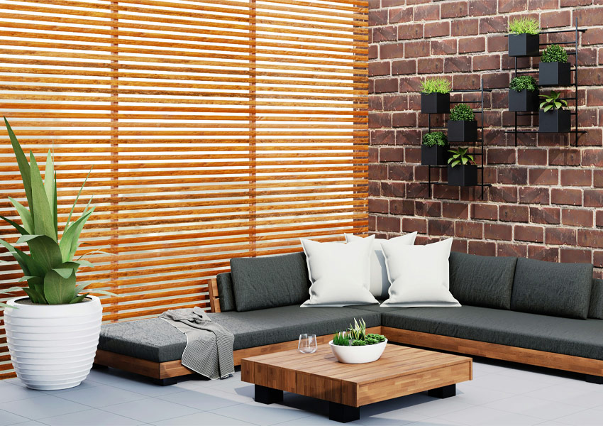 patio furniture and decor with plants Photo by Spacejoy on Unsplash